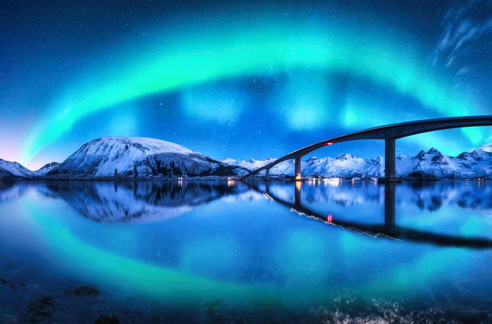 bridge and aurora borealis over snowy mountains 2023 11 27 05 27 01 utc