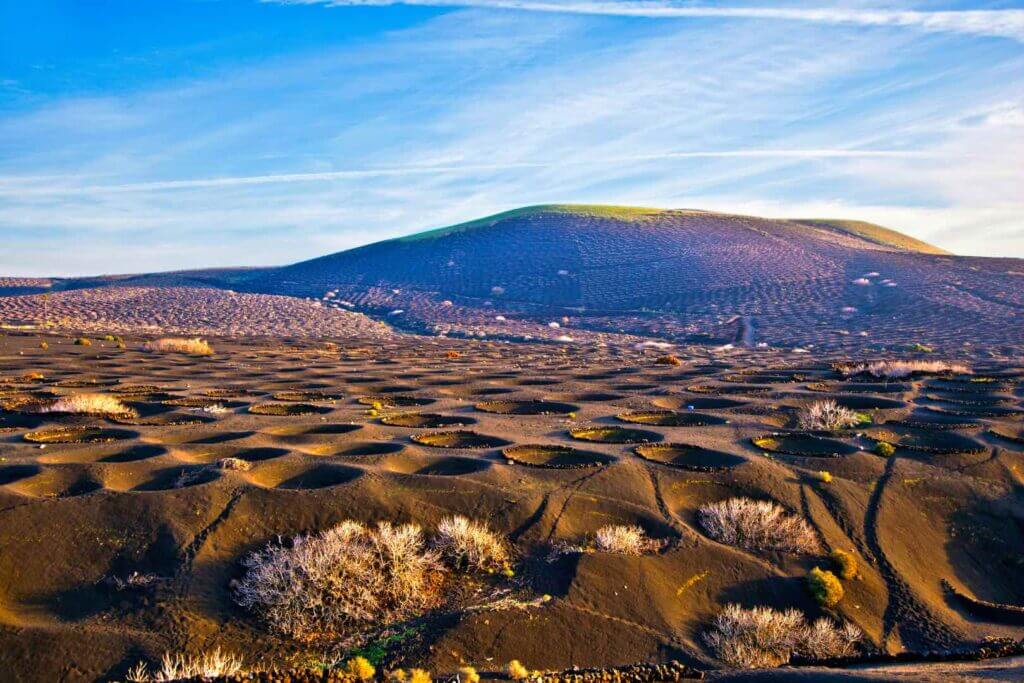 Lanzarote's Volcanic Landscape. The Holes are actually Vineyards